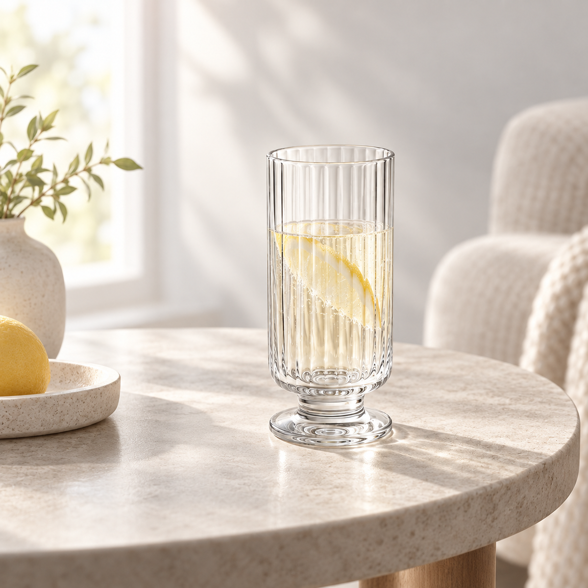 Solis Footed Flute Glass Set - one cup in an everyday table setting